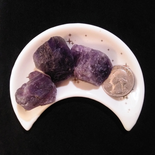 Amethyst Healing Crystal, Raw, 1 Stone, 3 stones in moon shaped dish on a black background