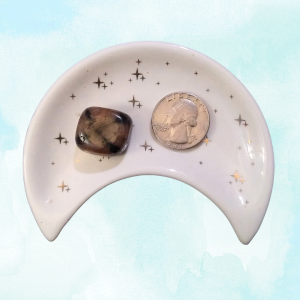 Andalusite Healing Crystal (Chiastolite), Tumbled, 1 Stone in moon-shaped dish on blue backgrround