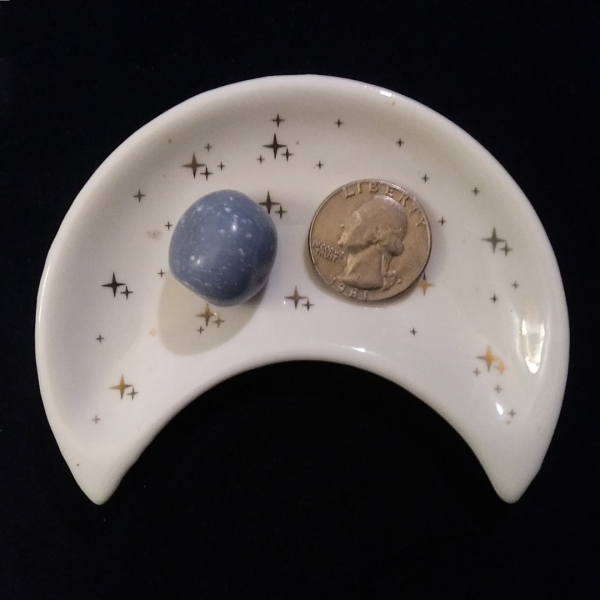 Angelite Healing Crystal, Tumbled, 1 Stone in moon-shaped dish on black background