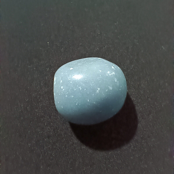 Angelite Healing Crystal, Tumbled, 1 Stone on black background