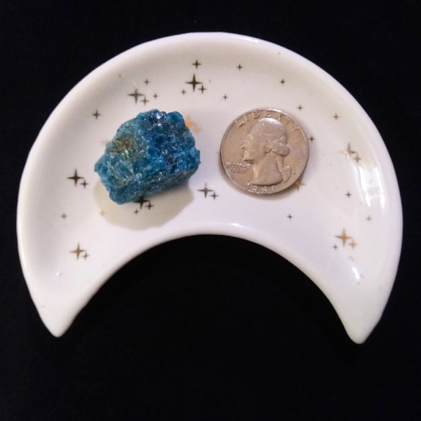 Apatite Healing Crystal, Raw, 1 Stone, in moon-shaped dish on black background