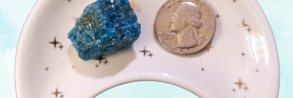 Apatite Healing Crystal, Raw, 1 Stone, in moon-shaped dish on light background
