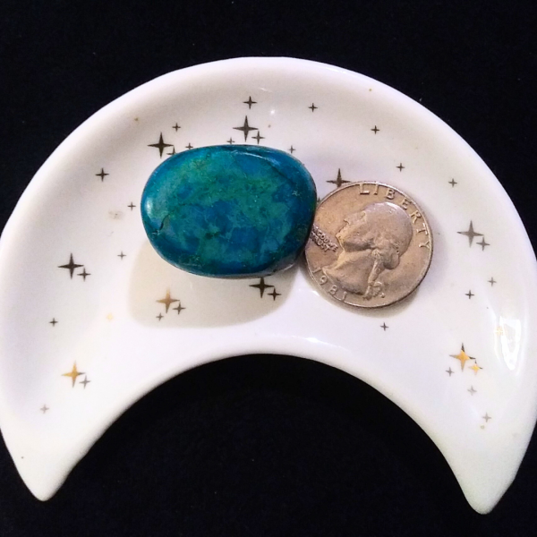Chrysocolla Healing Crystal, Tumbled, 1 Stone, in moon-shaped dish on black background