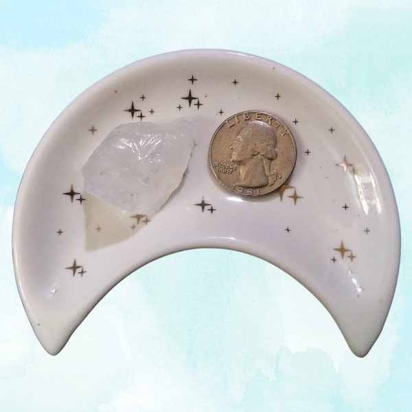Clear Quartz Healing Crystal, Raw, 1 Stone in moon-shaped dish on light background