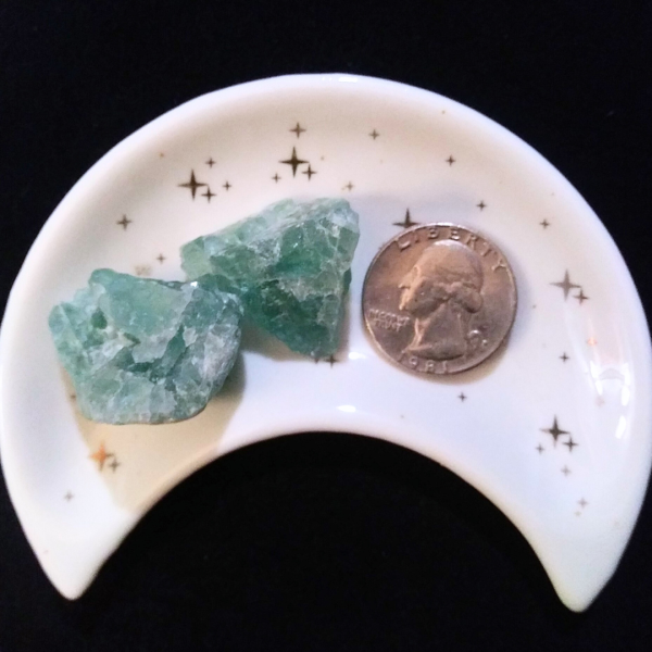Green Fluorite Healing Crystal, Raw, 1 Stone, 2 stones in moon-shaped dish on black background