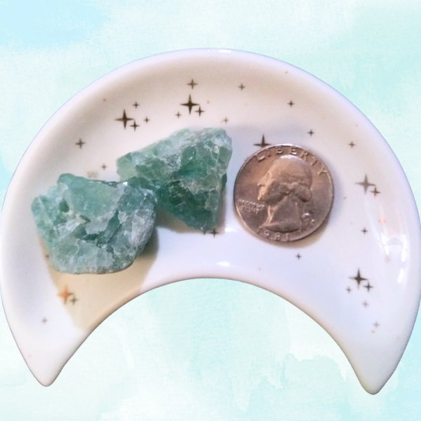 Green Fluorite Healing Crystal, Raw, 1 Stone, 2 stones in moon-shaped dish on light background
