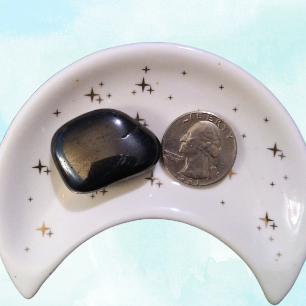 Hematite Healing Crystal, Tumbled, 1 Stone in moon-shaped dish on light background