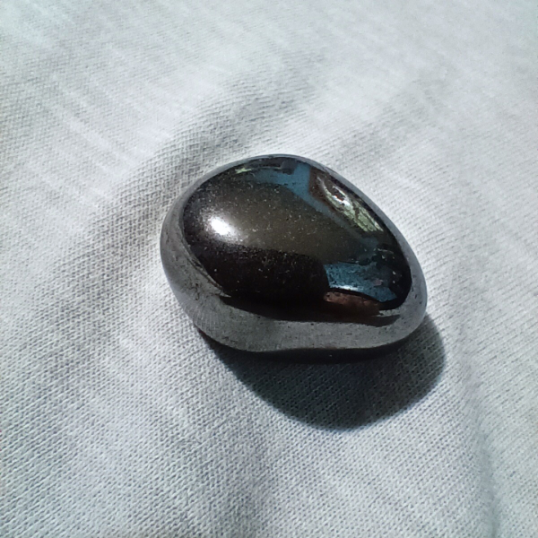 Hematite Healing Crystal, Tumbled, 1 Stone on light background