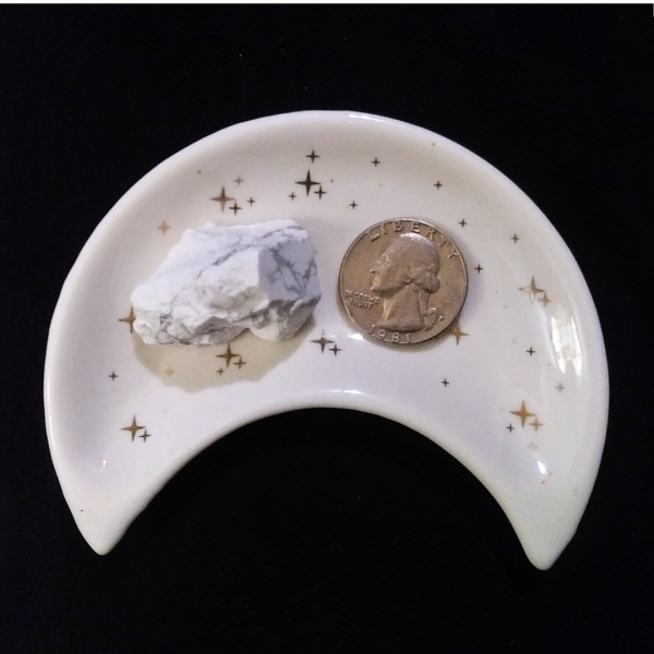 Howlite Healing Crystal, Rough, 1 Stone in moon-shaped dish on black background