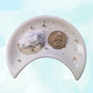 Howlite Healing Crystal, Rough, 1 Stone in moon-shaped dish on light background