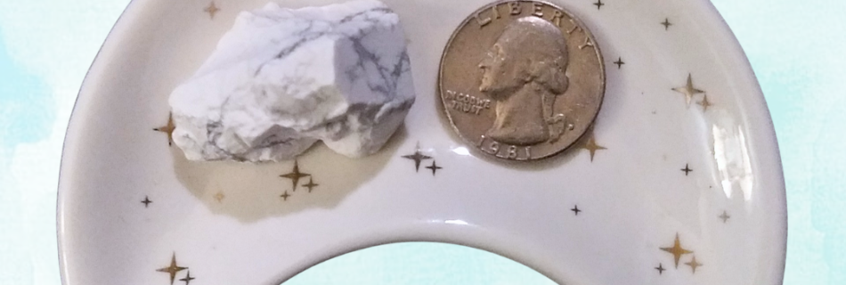Howlite Healing Crystal, Rough, 1 Stone in moon-shaped dish on light background