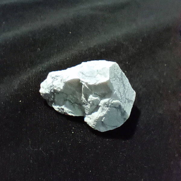 Howlite Healing Crystal, Rough, 1 Stone on black background (1)