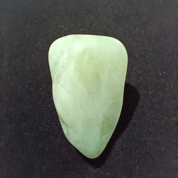 Jade Healing Crystal, Tumbled, 1 Stone on black background