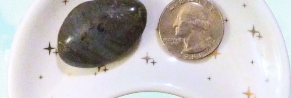 Labradorite Healing Crystal, Tumbled, 1 Stone in moon-shaped dish on light background
