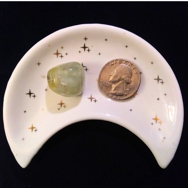 Prehnite Healing Crystal, Tumbled, 1 Stone in moon-shaped dish on black background