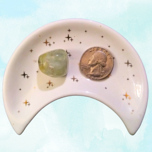 Prehnite Healing Crystal, Tumbled, 1 Stone in moon-shaped dish on light background