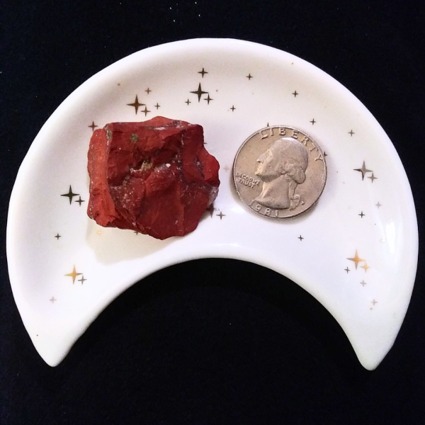 Red Jasper Healing Crystal, Raw, 1 Stone in moon-shaped dish on black background