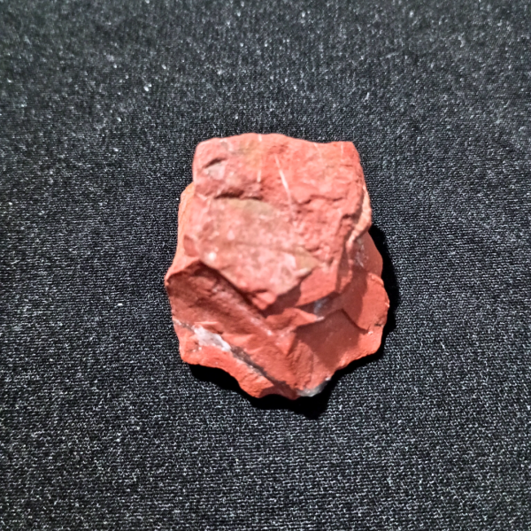Red Jasper Healing Crystal, Raw, 1 Stone on black background