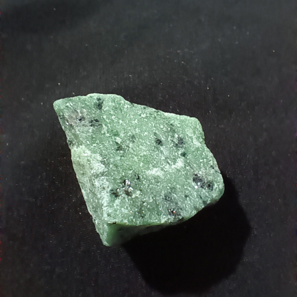 Ruby Zoisite Healing Crystal, Raw, 1 Stone on black background (1)