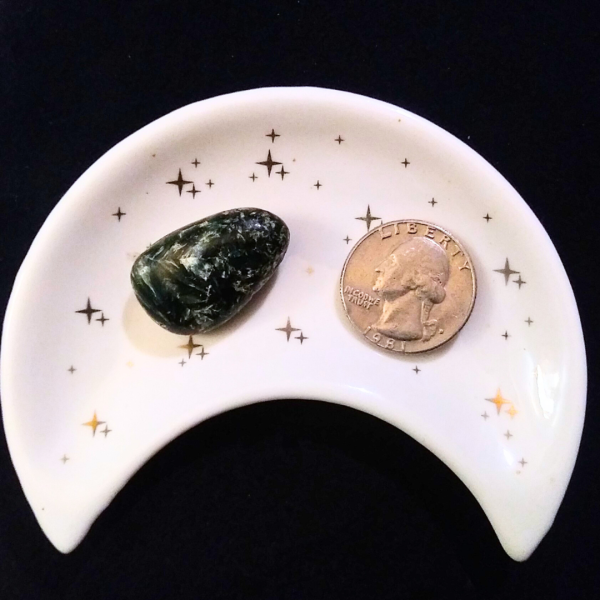 Seraphinite Healing Crystal, Tumbled, 1 Stone in moon-shaped dish on black background
