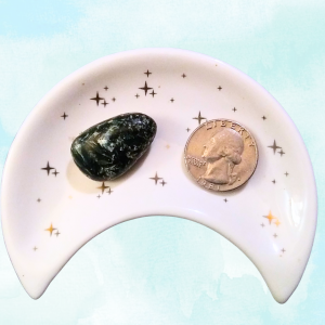 Seraphinite Healing Crystal, Tumbled, 1 Stone in moon-shaped dish on light background
