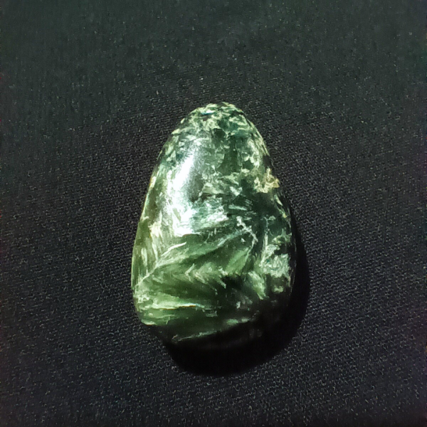 Seraphinite Healing Crystal, Tumbled, 1 Stone on black background