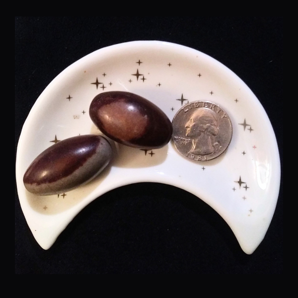 Shiva Lingam Healing Crystal, Tumbled, 1 Stone, 2 stones in moon-shaped dish on black background