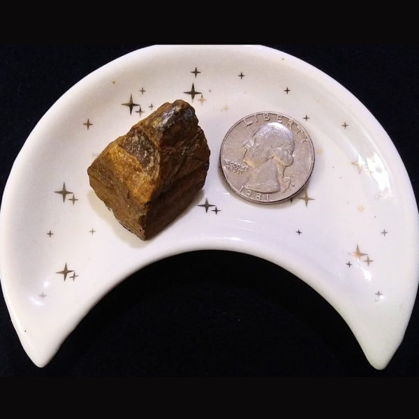 Tigers Eye Healing Crystal, Raw, 1 Stone in moon-shaped dish on black background