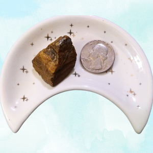 Tigers Eye Healing Crystal, Raw, 1 Stone in moon-shaped dish on light background