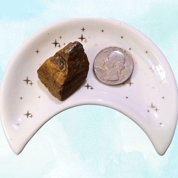 Tigers Eye Healing Crystal, Raw, 1 Stone in moon-shaped dish on light background