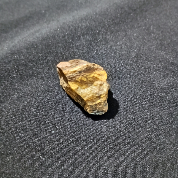 Tigers Eye Healing Crystal, Raw, 1 Stone on black background (1)