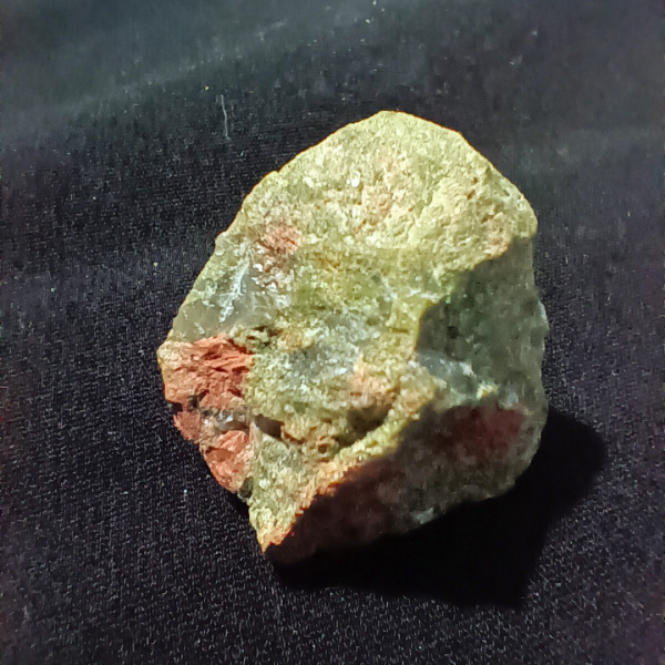 Unakite Healing Crystal, Raw, 1 Stone on black background