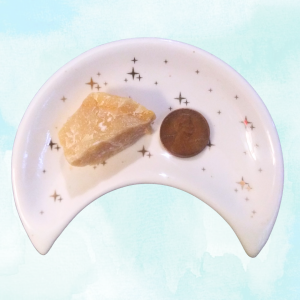 Yellow Aventurine Healing Crystal, Raw, 1 Stone in moon-shaped dish on light background