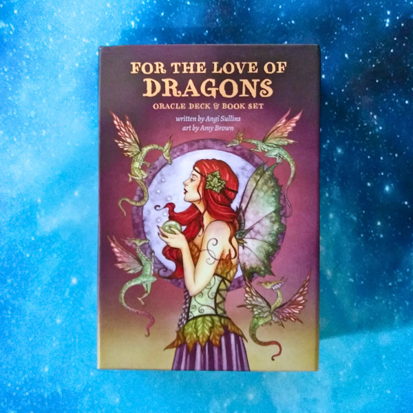 For the Love of Dragons Oracle Deck and Book Set by Angi Sullins and Amy Brown - flat lay of box on starry blue background