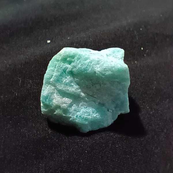 Amazonite Healing Crystal, Raw, 1 Stone, close up 1, light bluish stone on black background