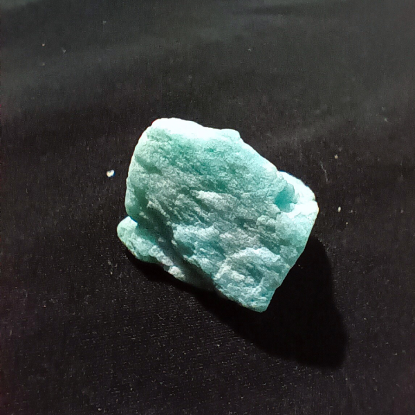 Amazonite Healing Crystal, Raw, 1 Stone, close up 2, light bluish stone on black background