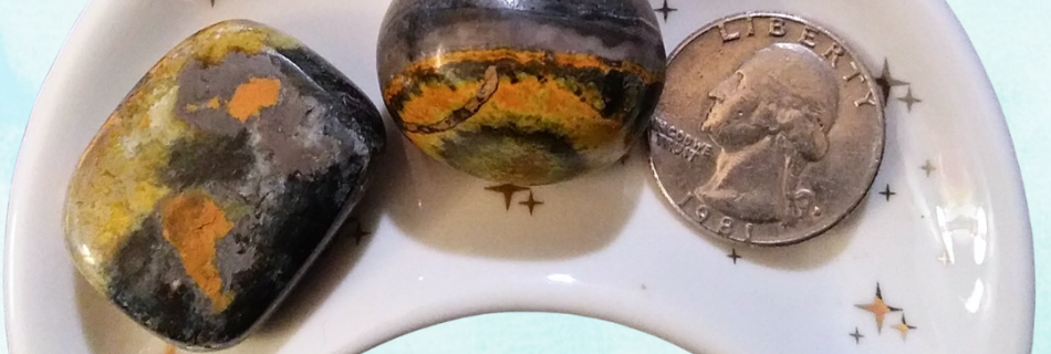 Bumblebee Jasper Healing Crystal, Tumbled, 1 Stone, stones in moon-shaped dish on light background