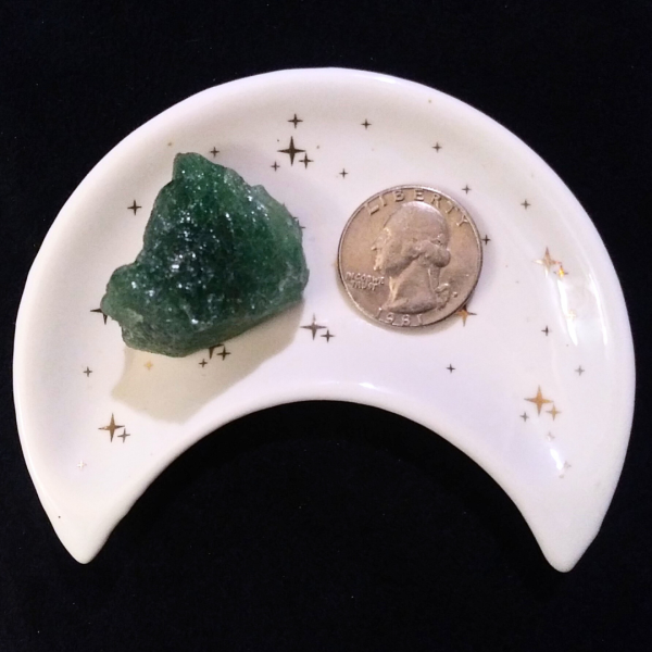 Green Strawberry Quartz Healing Crystal, Raw, 1 Stone in moon-shaped dish on black background