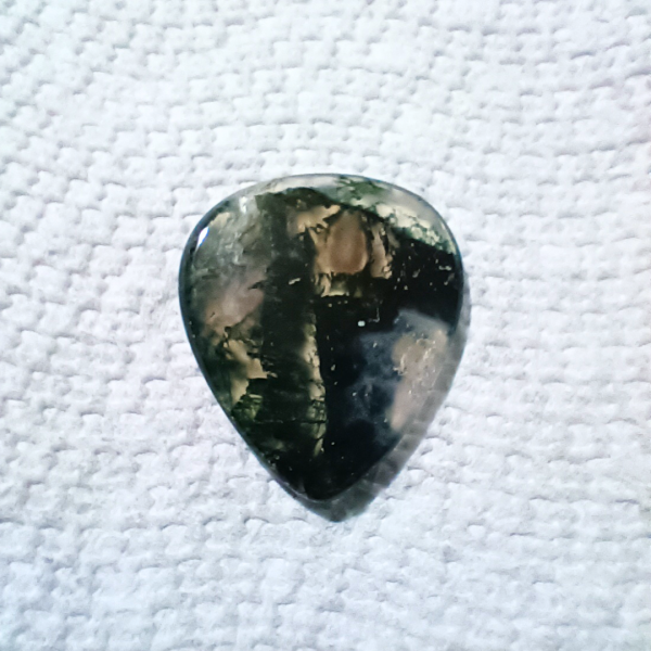 Moss Agate Healing Crystal, Guitar Pick, 1 Pick on light background