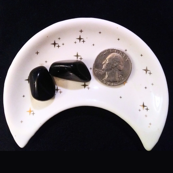 Obsidian Healing Crystal, Tumbled, 1 Stone in moon-shaped dish on black background