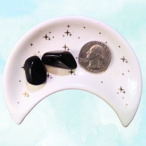 Obsidian Healing Crystal, Tumbled, 1 Stone in moon-shaped dish on light background