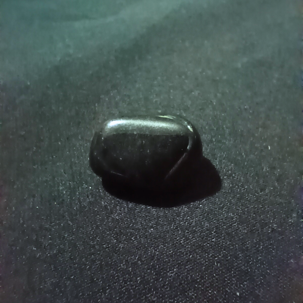 Obsidian Healing Crystal, Tumbled, 1 Stone on black background