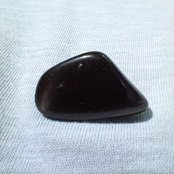 Obsidian Healing Crystal, Tumbled, 1 Stone on light background (2)