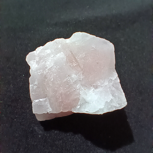 Rose Quartz Healing Crystal, Rough, 1 Stone on black background