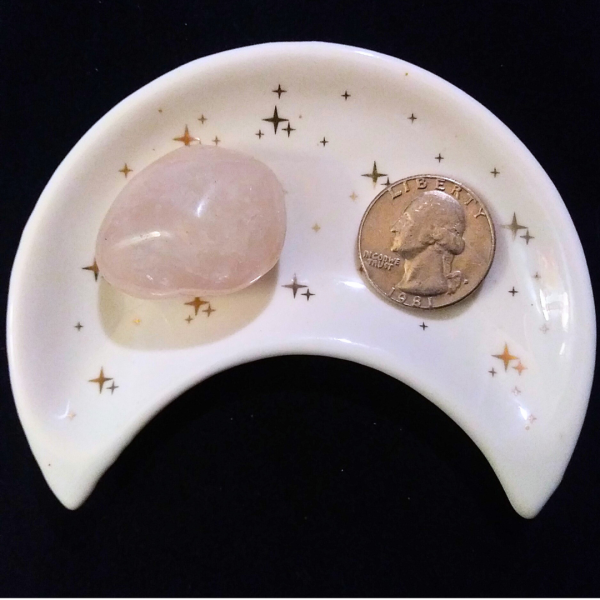 Rose Quartz Healing Crystal, Tumbled, 1 Stone in moon-shaped dish on black background