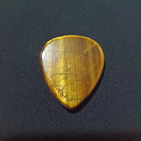 Tigers Eye Healing Crystal, Guitar Pick, 1 Pick on black background (1)