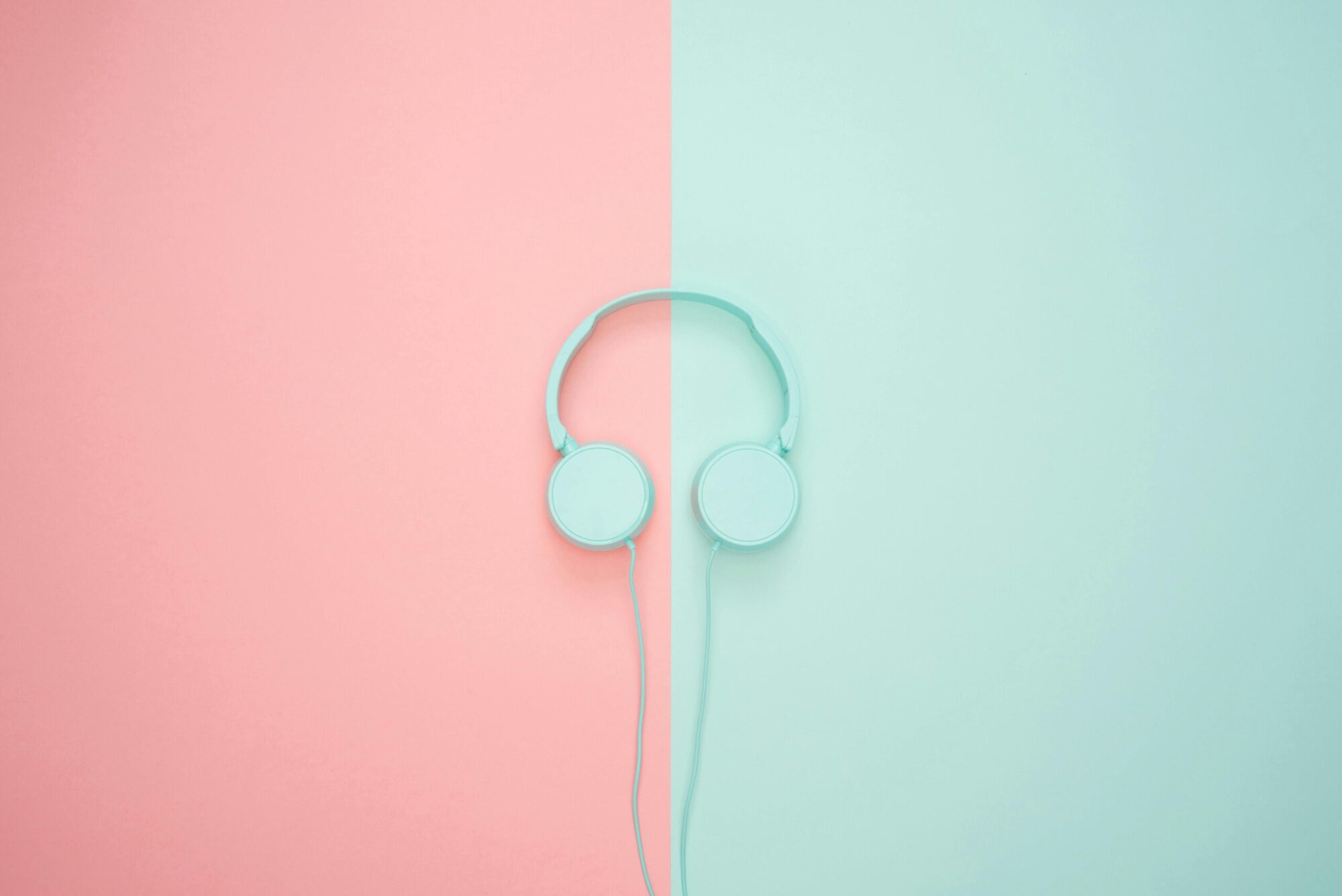 Headphones on a pink and blue background