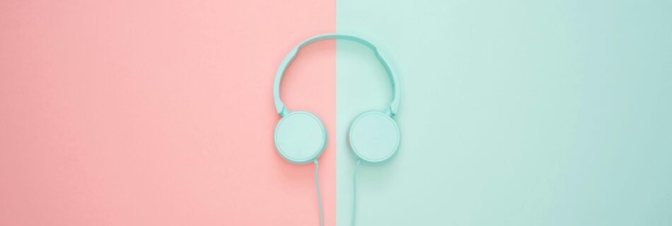 Headphones on a pink and blue background