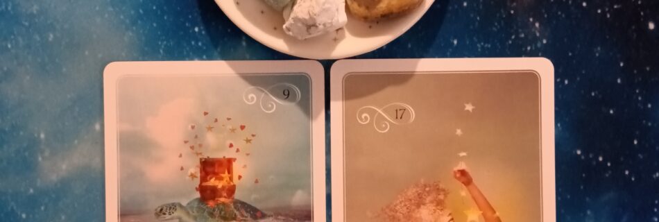 2 Wisdom of the Oracle cards and crystals on a starry blue background