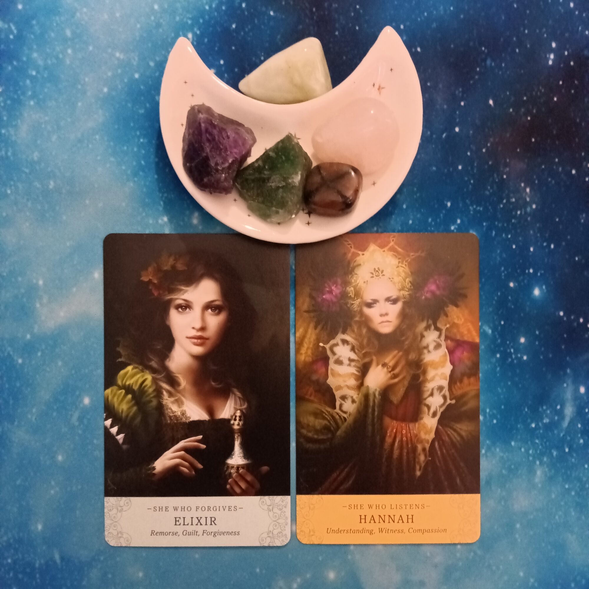 Forgiveness and Compassion ~ A Message From the Universe, Elle Qui Oracle Cards and crystals on a starry blue background